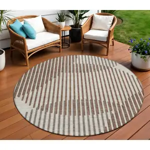 Photo of 8' Brown And Beige Round Geometric Washable Indoor Outdoor Area Rug