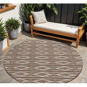 Photo of 8' Brown And Beige Round Geometric Washable Indoor Outdoor Area Rug
