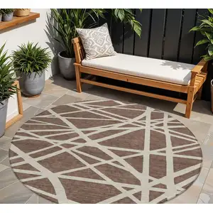 Photo of 8' Brown And Beige Round Geometric Washable Indoor Outdoor Area Rug