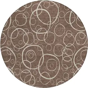 Photo of 8' Brown And Beige Round Geometric Washable Indoor Outdoor Area Rug