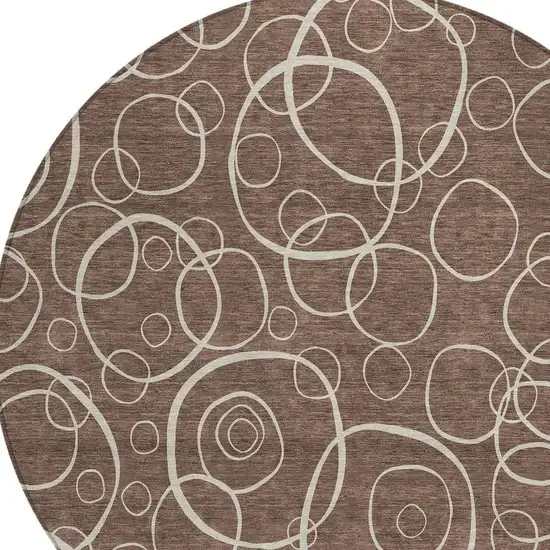 8' Brown And Beige Round Geometric Washable Indoor Outdoor Area Rug Photo 2