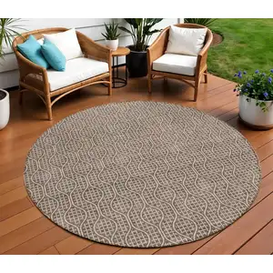 Photo of 8' Brown And Beige Round Geometric Washable Indoor Outdoor Area Rug