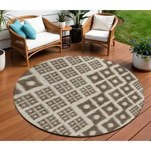 Photo of 8' Brown And Beige Round Geometric Washable Indoor Outdoor Area Rug