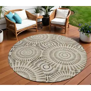 Photo of 8' Brown And Beige Round Geometric Washable Indoor Outdoor Area Rug