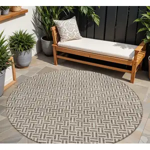 Photo of 8' Brown And Beige Round Geometric Washable Indoor Outdoor Area Rug