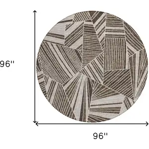 Photo of 8' Brown And Beige Round Geometric Washable Indoor Outdoor Area Rug