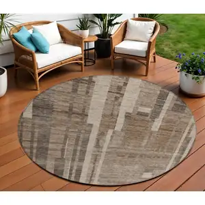 Photo of 8' Brown And Beige Round Striped Washable Indoor Outdoor Area Rug