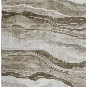Photo of 8' Brown And Beige Striped Washable Area Rug With UV Protection