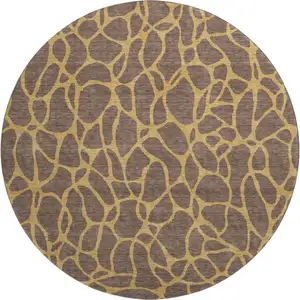 Photo of 8' Brown And Gold Geometric Washable Round Rug With UV Protection