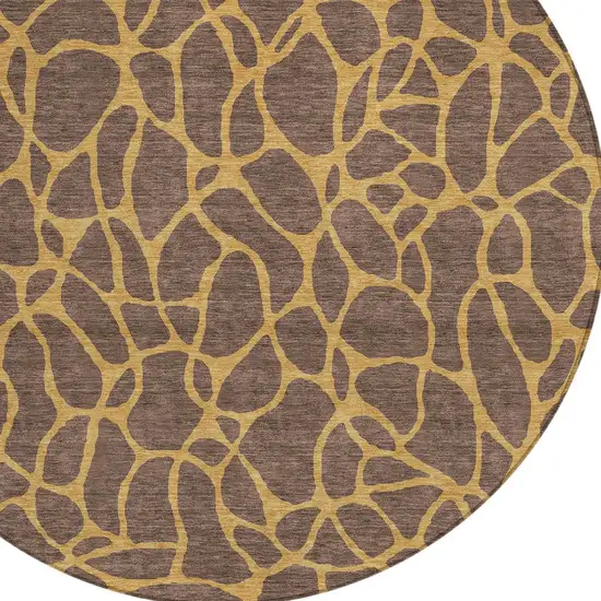 8' Brown And Gold Round Geometric Washable Indoor Outdoor Area Rug Photo 4