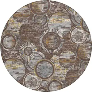 Photo of 8' Brown And Gold Round Geometric Washable Indoor Outdoor Area Rug