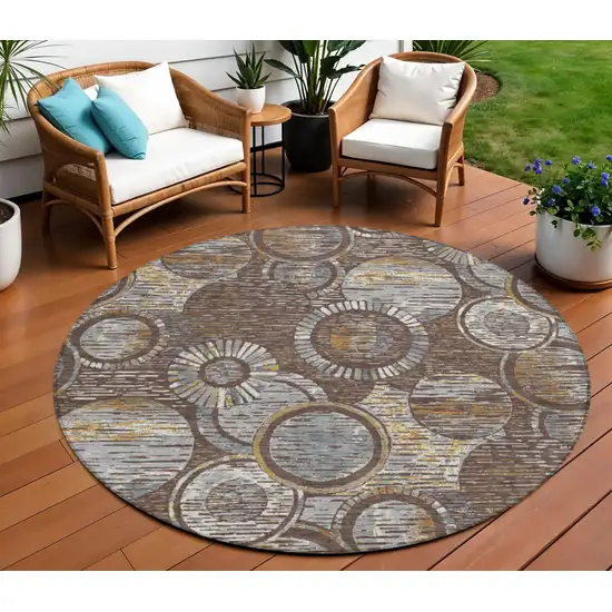8' Brown And Gold Round Geometric Washable Indoor Outdoor Area Rug Photo 2