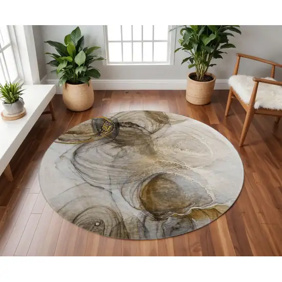 8' Brown And Ivory Abstract Washable Round Rug With UV Protection Photo 2