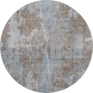 Photo of 8' Brown And Ivory Abstract Washable Round Rug With UV Protection