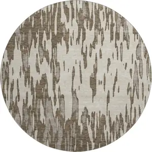 Photo of 8' Brown And Ivory Abstract Washable Round Rug With UV Protection