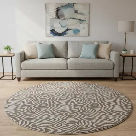 8' Brown And Ivory Abstract Washable Round Rug With UV Protection Photo 2