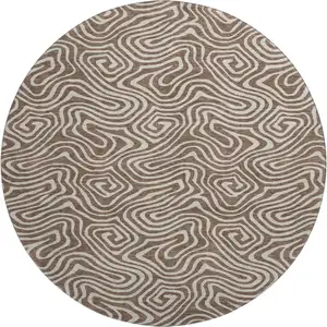 Photo of 8' Brown And Ivory Abstract Washable Round Rug With UV Protection