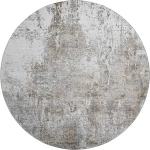 Photo of 8' Brown And Ivory Abstract Washable Round Rug With UV Protection