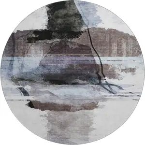 Photo of 8' Brown And Ivory Abstract Washable Round Rug With UV Protection