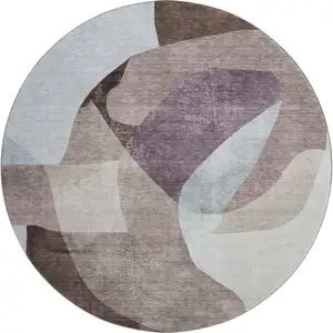 Photo of 8' Brown And Ivory Abstract Washable Round Rug With UV Protection
