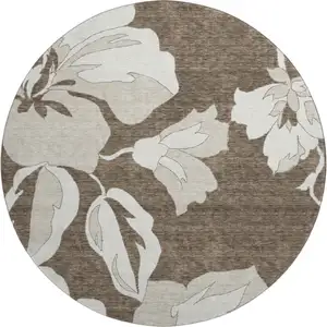 Photo of 8' Brown And Ivory Floral Washable Round Rug With UV Protection