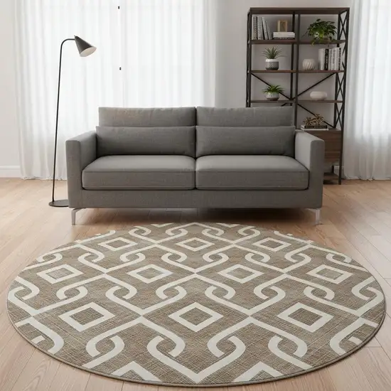 8' Brown And Ivory Geometric Washable Round Rug With UV Protection Photo 2