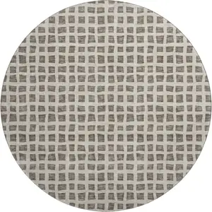 Photo of 8' Brown And Ivory Geometric Washable Round Rug With UV Protection