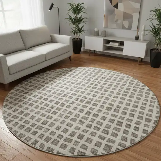 8' Brown And Ivory Geometric Washable Round Rug With UV Protection Photo 2