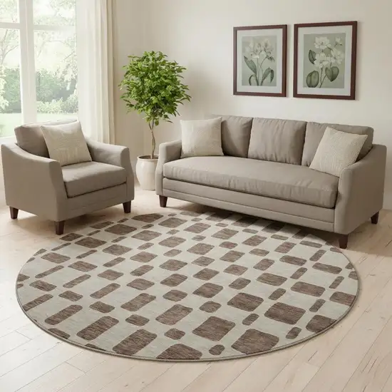 8' Brown And Ivory Geometric Washable Round Rug With UV Protection Photo 1