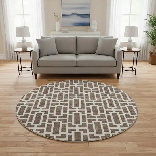 8' Brown And Ivory Geometric Washable Round Rug With UV Protection Photo 2
