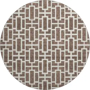 Photo of 8' Brown And Ivory Geometric Washable Round Rug With UV Protection