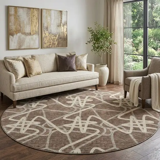 8' Brown And Ivory Geometric Washable Round Rug With UV Protection Photo 1