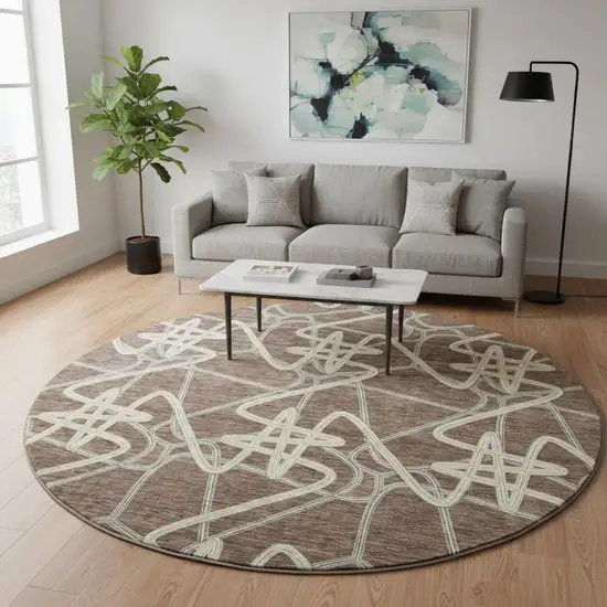 8' Brown And Ivory Geometric Washable Round Rug With UV Protection Photo 2