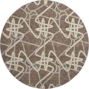 Photo of 8' Brown And Ivory Geometric Washable Round Rug With UV Protection