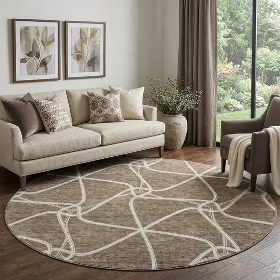 8' Brown And Ivory Geometric Washable Round Rug With UV Protection Photo 1
