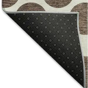 Photo of 8' Brown And Ivory Polka Dot Washable Round Rug With UV Protection