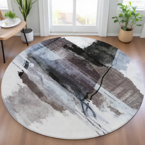 8' Brown And Ivory Round Abstract Washable Indoor Outdoor Area Rug Photo 6