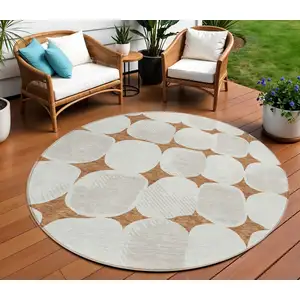 Photo of 8' Brown And Ivory Round Abstract Washable Indoor Outdoor Area Rug