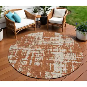 Photo of 8' Brown And Ivory Round Abstract Washable Indoor Outdoor Area Rug