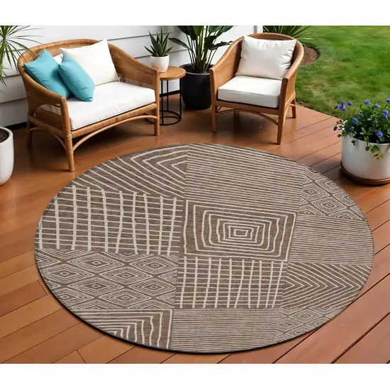 8' Brown And Ivory Round Geometric Washable Indoor Outdoor Area Rug Photo 1