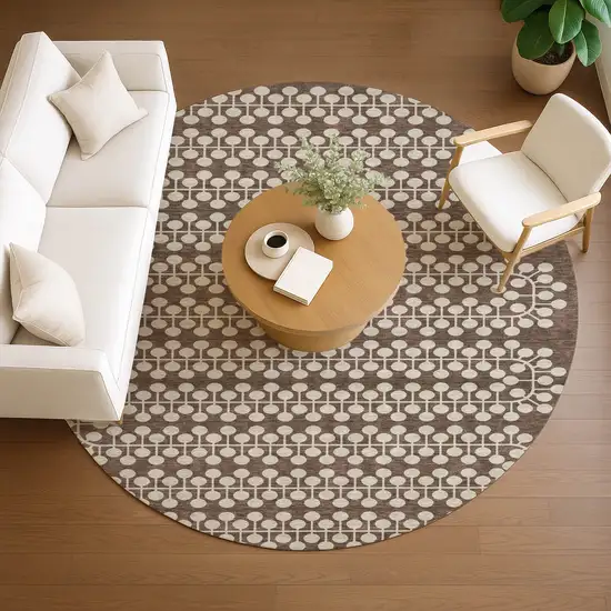 8' Brown And Ivory Round Geometric Washable Indoor Outdoor Area Rug Photo 8