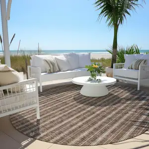 Photo of 8' Brown And Ivory Round Striped Washable Indoor Outdoor Area Rug