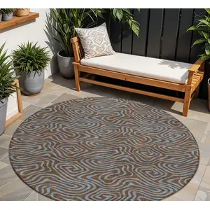 Photo of 8' Brown And Light Blue Round Abstract Washable Indoor Outdoor Area Rug