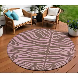 Photo of 8' Brown And Pink Round Animal Print Washable Indoor Outdoor Area Rug
