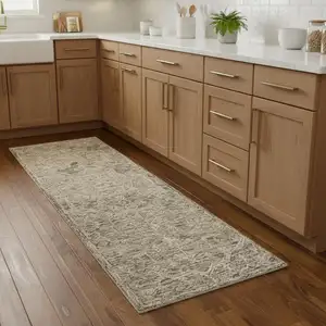 Photo of 8' Brown And Tan Wool Floral Hand Tufted Runner Rug