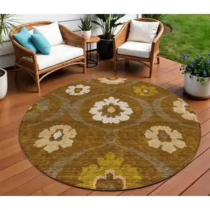Photo of 8' Brown Beige And Gold Round Medallion Washable Indoor Outdoor Area Rug