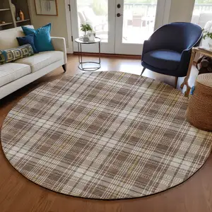 Photo of 8' Brown Beige And Gold Round Plaid Washable Indoor Outdoor Area Rug