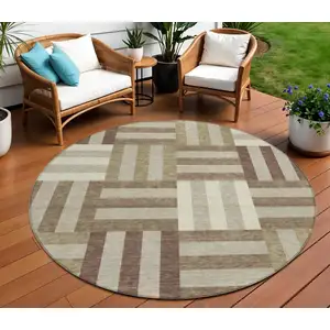 Photo of 8' Brown Beige And Ivory Round Geometric Washable Indoor Outdoor Area Rug