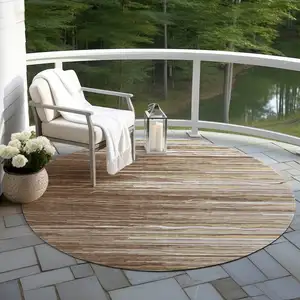 Photo of 8' Brown Beige And Ivory Round Striped Washable Indoor Outdoor Area Rug