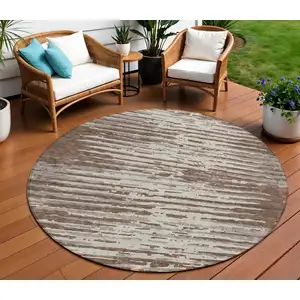 Photo of 8' Brown Beige And Ivory Round Striped Washable Indoor Outdoor Area Rug